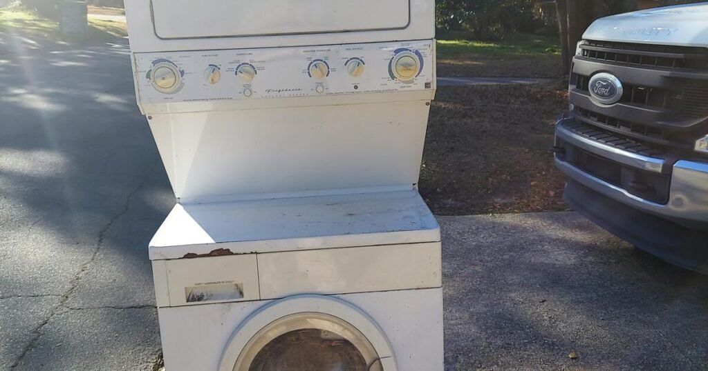 Discarded Frigidaire laundry center: washing machine and dryer unit, difficult waste.