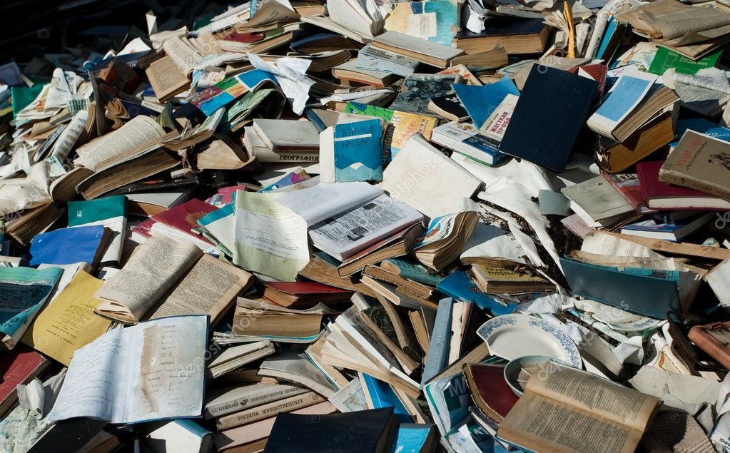 Difficult waste: Pile of discarded books and paper. Recycling old books helps reduce waste.