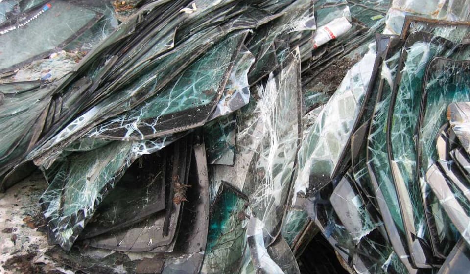 Pile of broken glass. Difficult waste management. Recycling glass concept.