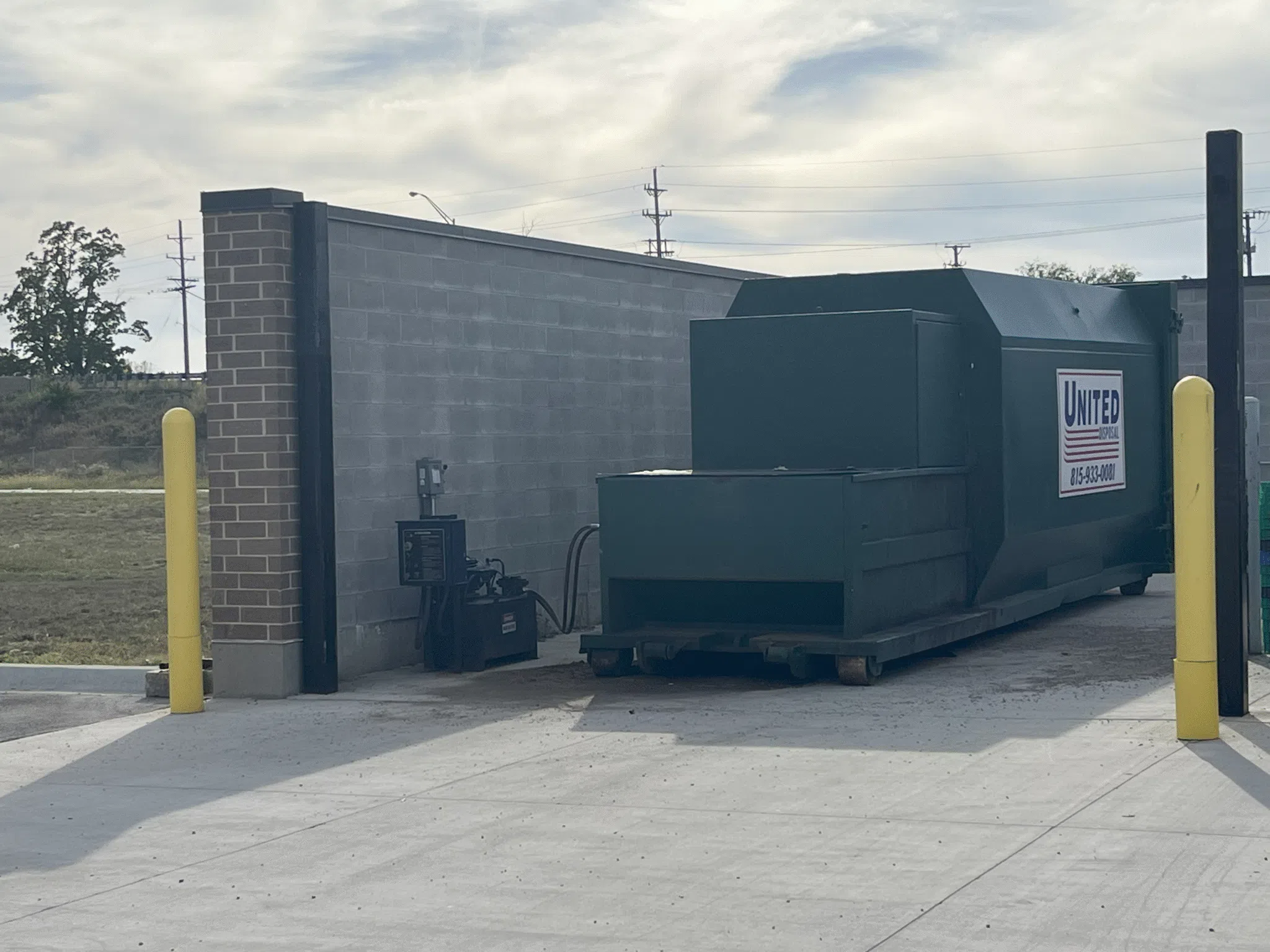 United Disposal commercial trash compactor. Waste management solution for businesses.